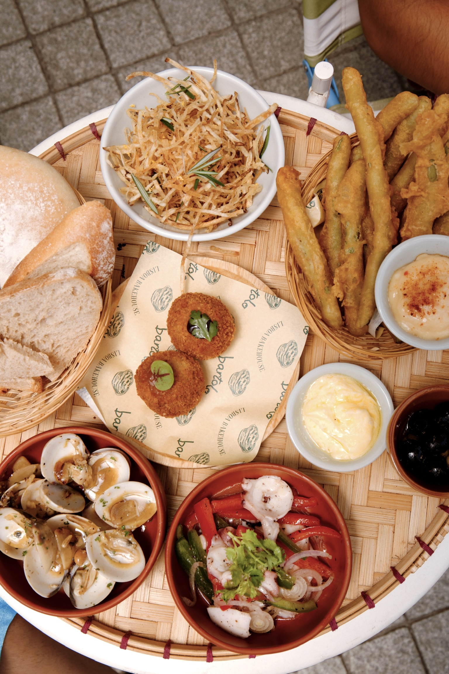 Bartolo venue — tabua de petiscos overhead, Portuguese sharing plates