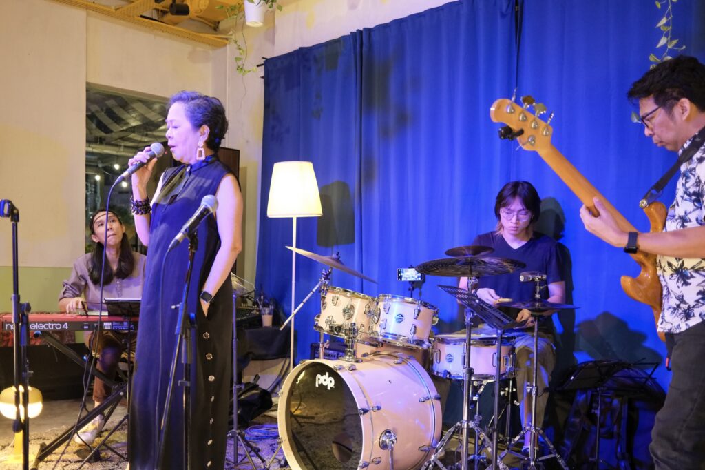 Live event at Bartolo Lisboa Bakehouse — band on stage with vocalist, drummer and bassist