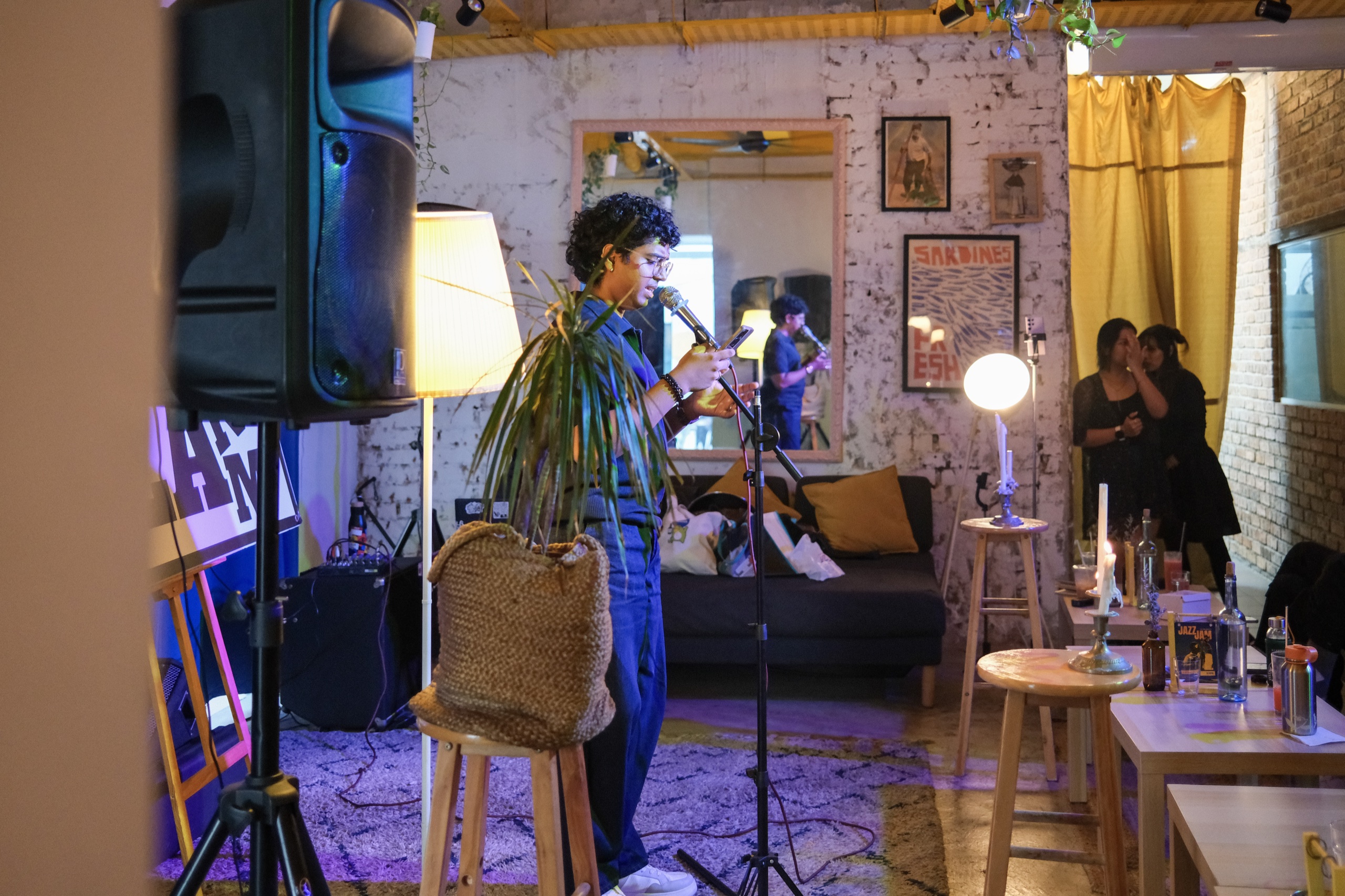 Live event at Bartolo Lisboa Bakehouse — performer at microphone in intimate lounge