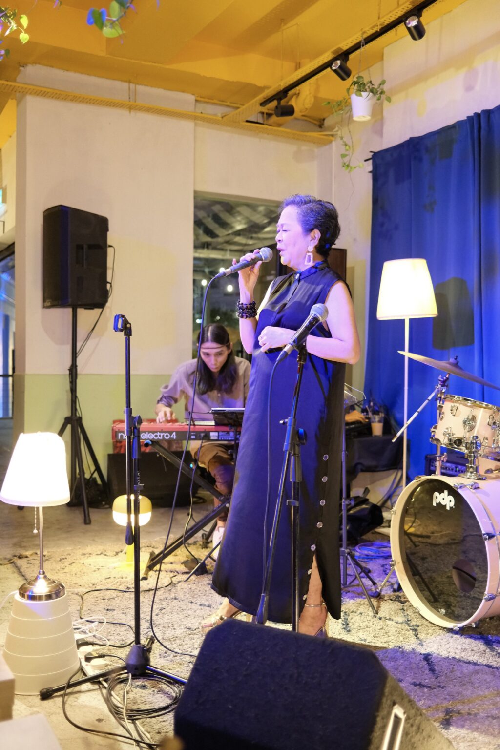 Vocalist and pianist on the mezzanine stage at Bartolo