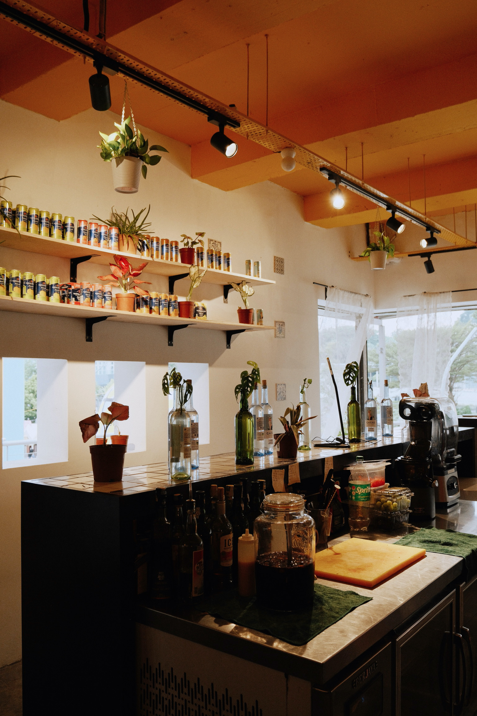 Bartolo Lisboa Bakehouse — Central Market location bar and counter with shelves of artisanal products and Portuguese tile decor